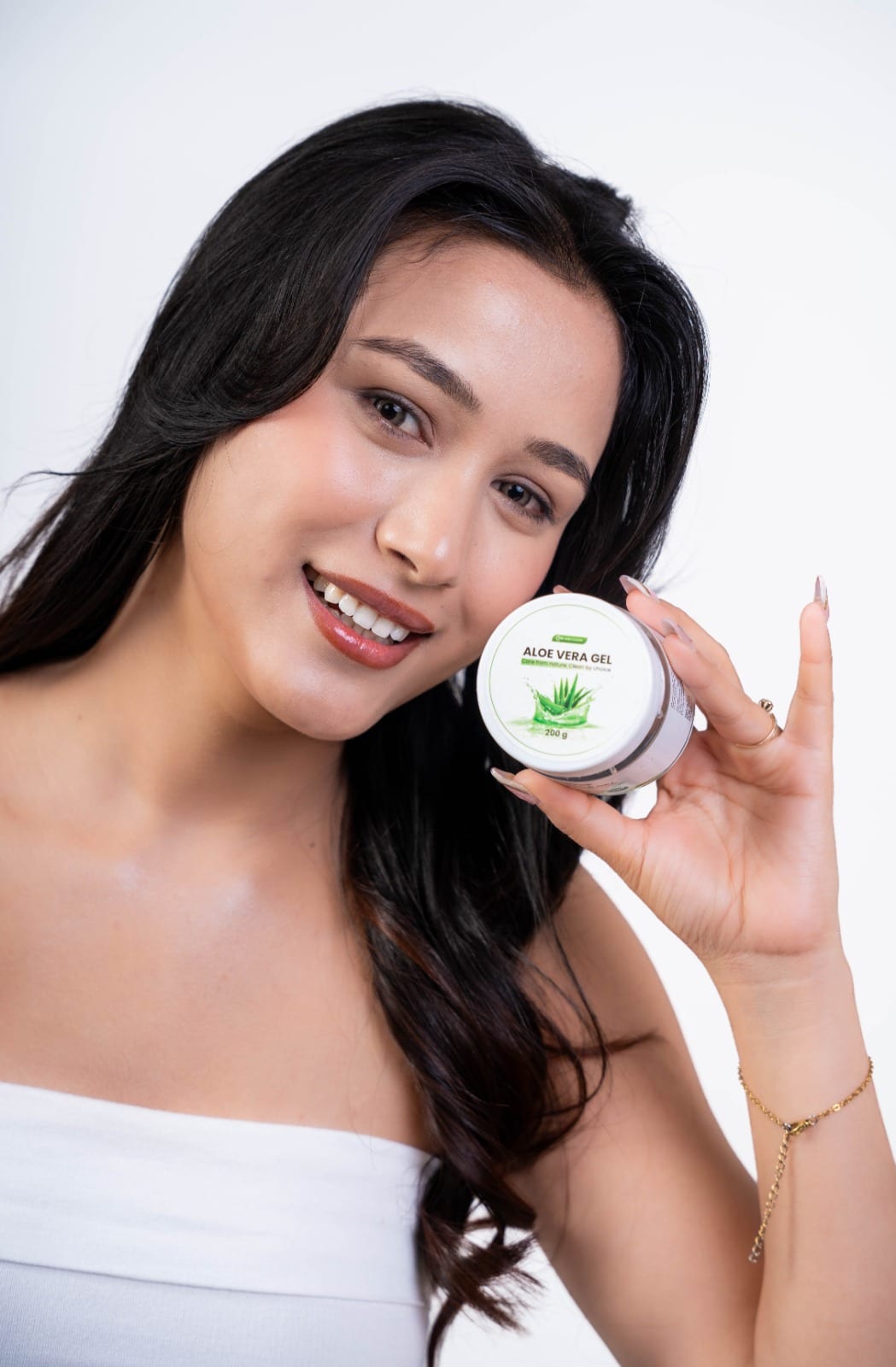 Smiling woman holding Care & Clean Aloe Vera Gel