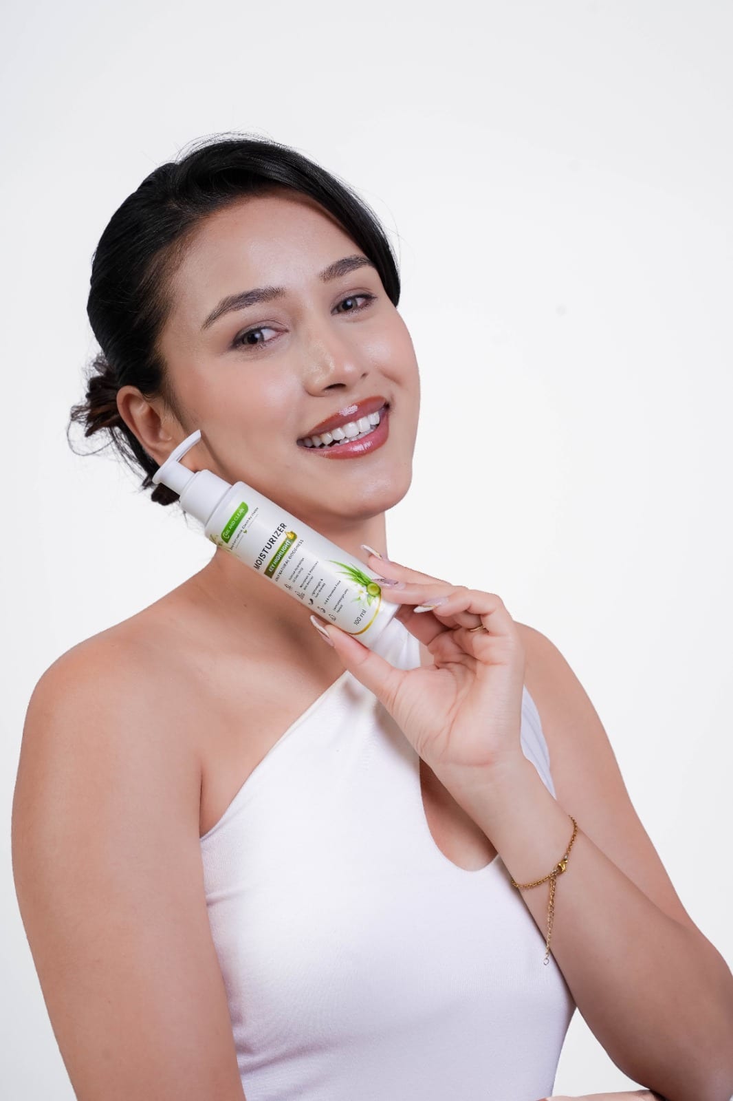 Smiling woman holding Care & Clean moisturizer